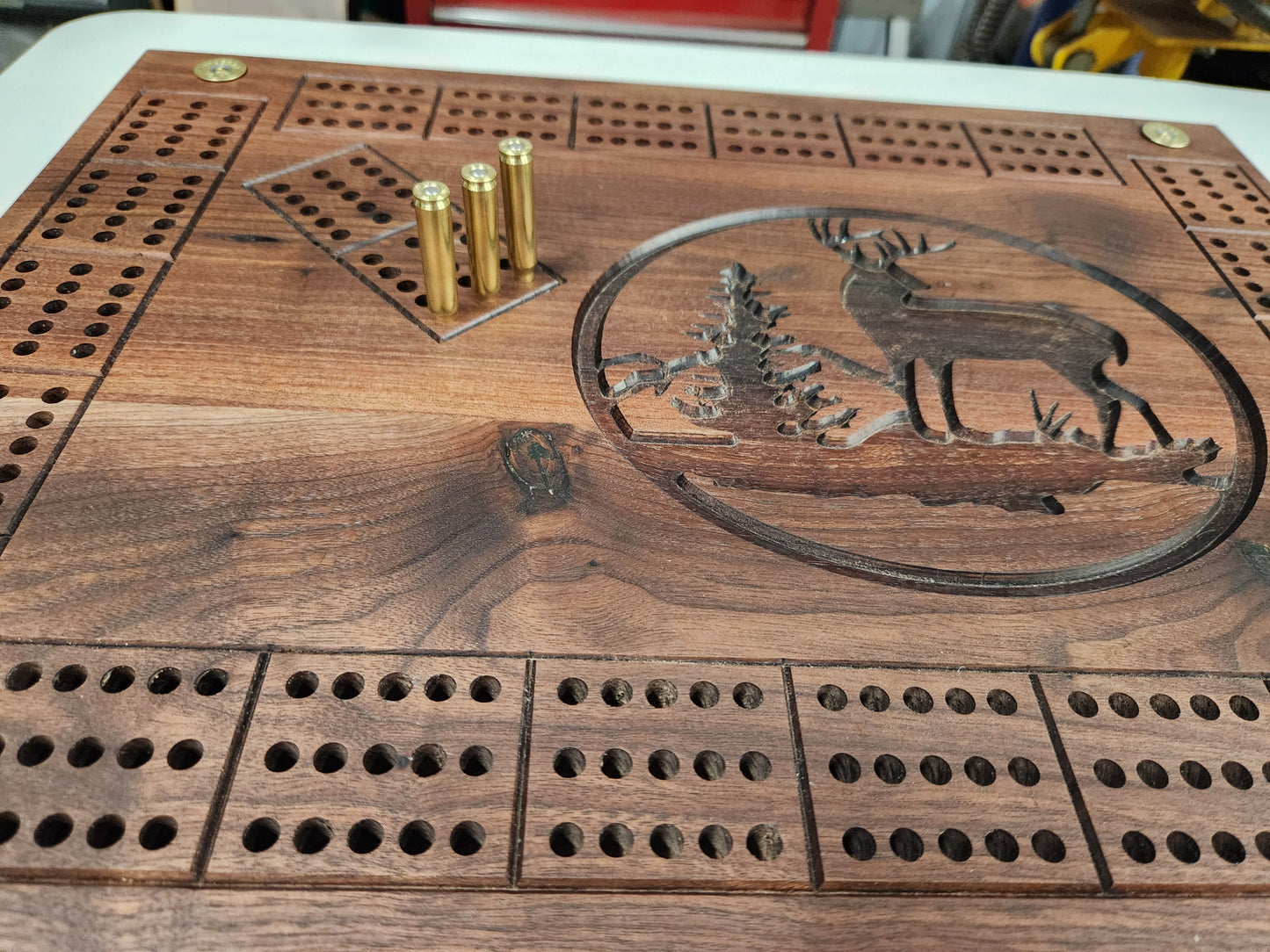 Deer cribbage board with bullet pegs