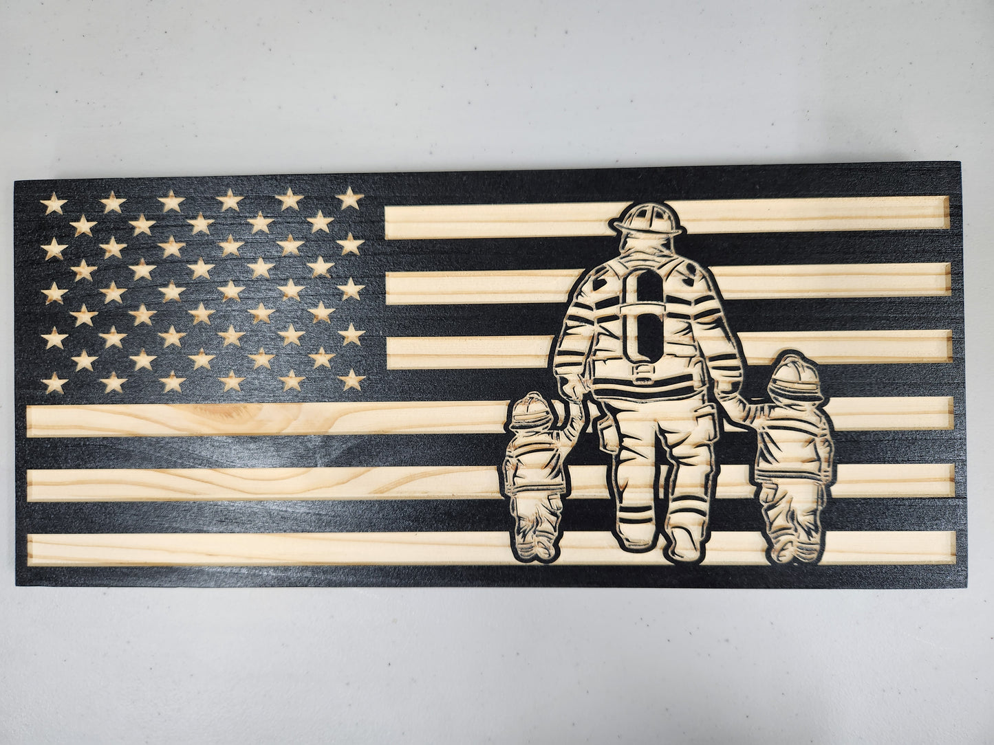 Firefighter with two children flag