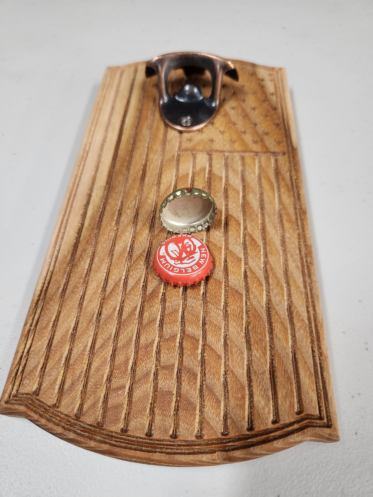 Bottle opener with magnetic back